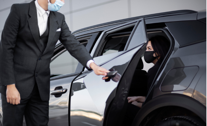 chauffeur opening car door